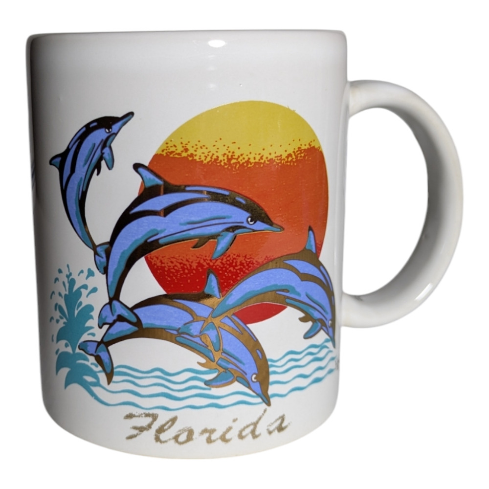 Collectible Ceramic Souvenir Mug Featuring A Dolphin Design And Florida